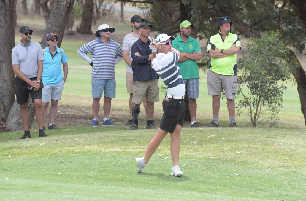 Lucas Herbert launches his approach shot on the par-five 13th hole at Axedale. Picture: NONI HYETT