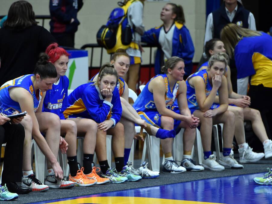 GUTTED: The Bendigo Lady Braves after their two-point loss to the Kilsyth Lady Cobras in the women's south conference final. Picture: JODIE WIEGARD