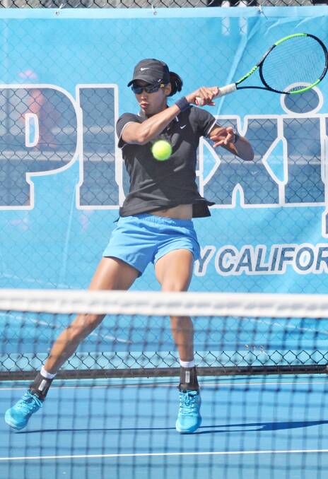 POWER: Astra Sharma belts a forehand in her impressive win in the opening round of qualifying. Pictures: DARREN HOWE