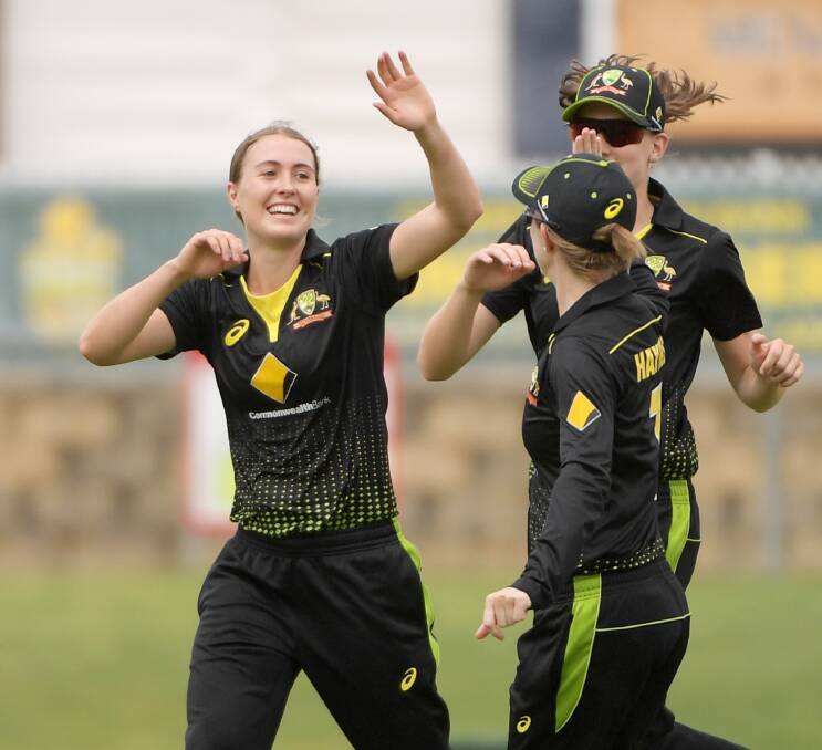 SPEED DEMON: Tayla Vlaeminck celebrates a wicket with her Australian team-mates. Picture: GETTY IMAGES