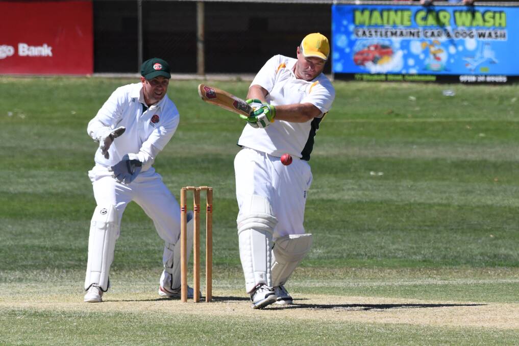 Castlemaine's Bryan Brasher plays a pull shot in his innings of 98 against Gisborne. Picture: NONI HYETT