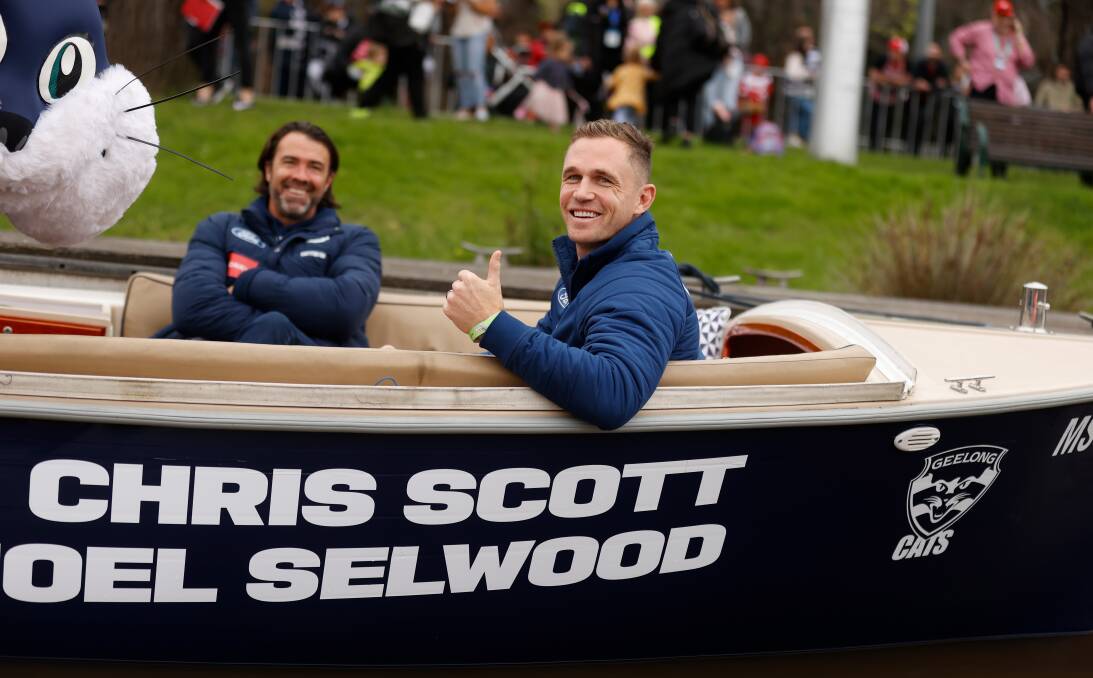 Joel Selwood and Chris Scott were all smiles during the AFL grand final parade on the Yarra River on Friday. Picture by Getty Images