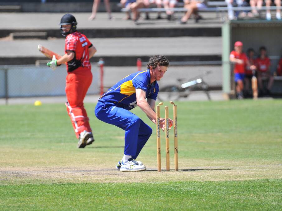 Golden Square bowler Connor Miller breaks the stumps in a bid for a run out. Picture: ADAM BOURKE