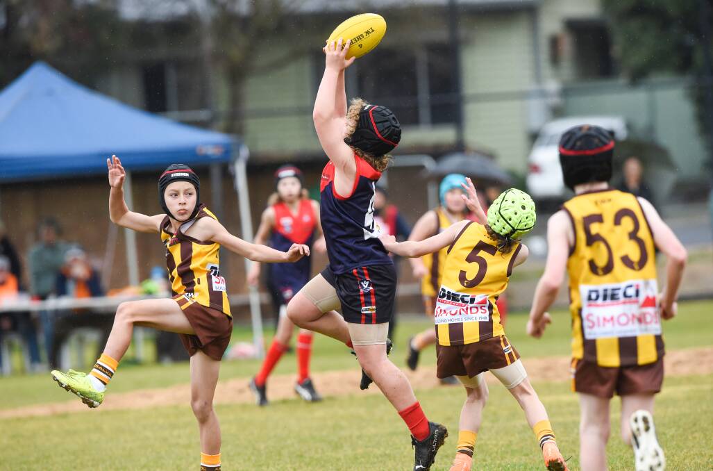 Huntly and Quarry Hill did battle in the BJFL under-12C division. Pictures: DARREN HOWE
