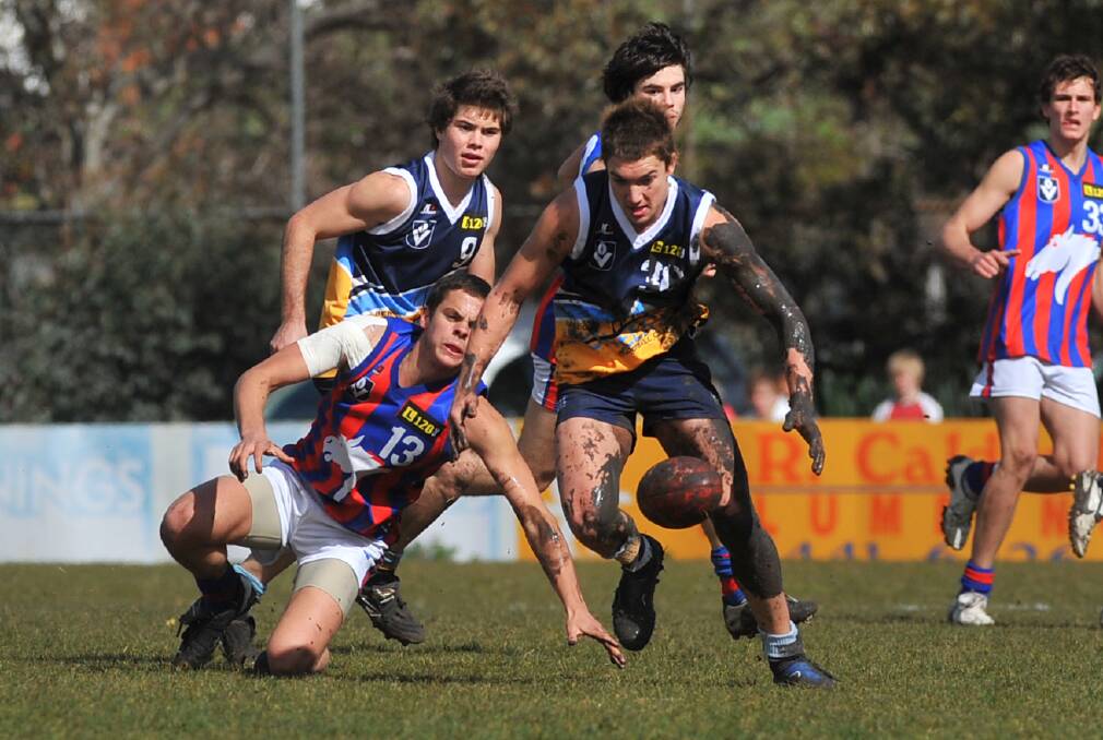 BALL MAGNET: Dustin Martin wins possession of the ball in the mud in a Pioneers game at Wade Street.