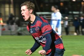 Logan Hromenko celebrates a crucial goal in Epsom's 4-2 win over Shepparton United on Saturday night. Pictures by Adam Bourke