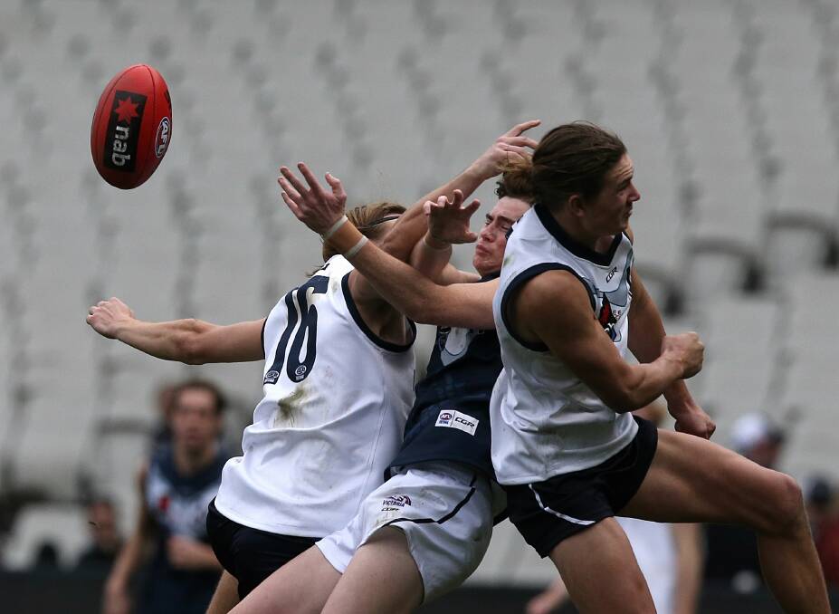 CRUNCH: Action from the Victoria Country versus Victoria Metro game at the MCG on Sunday. Picture: FAIRFAX MEDIA