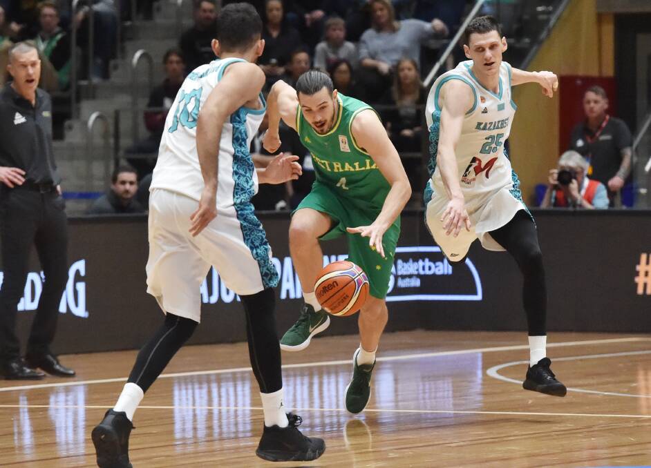 Chris Goulding grabs a steal for the Boomers in the 2018 game against Kazakhstan in Bendigo.