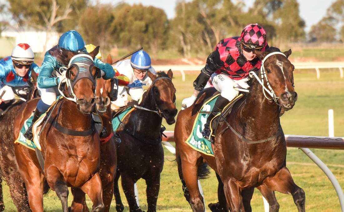 Royal Tyke, right, wins in Kym Hann's pick and black silks. Picture: RACING PHOTOS