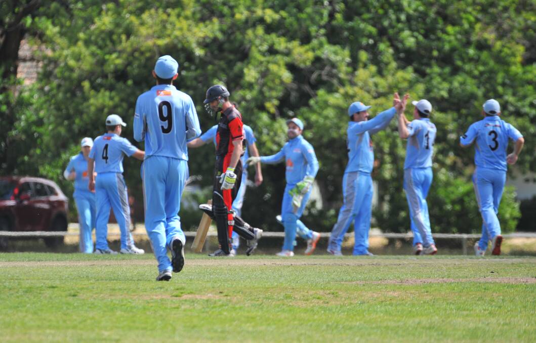 Strathdale-Maristians players celebrate the wicket of Ollie Geary for a golden duck.