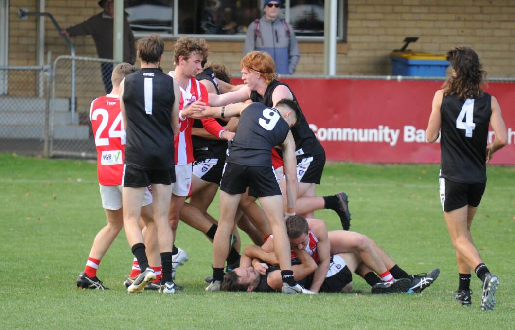 Castlemaine and South Bendigo players get to know each other better during the second term on Saturday.