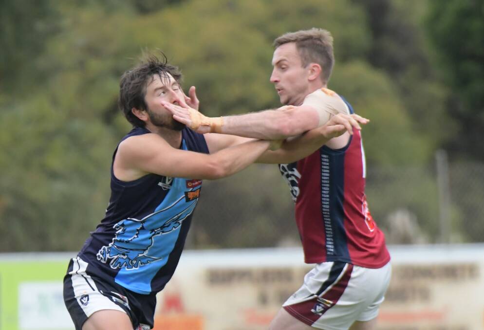 Eaglehawk's Brodie Collins and Sandhurst's Jake McLean. Picture: NONI HYETT