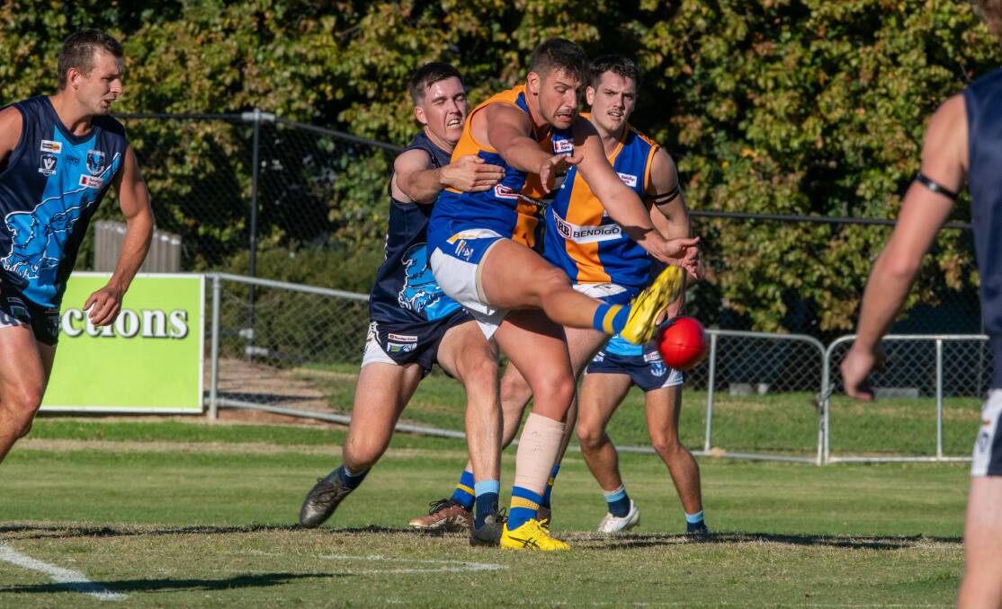 Golden Square ruckman Tanner Rayner gets a kick away in the Dogs' round one loss to Eaglehawk.