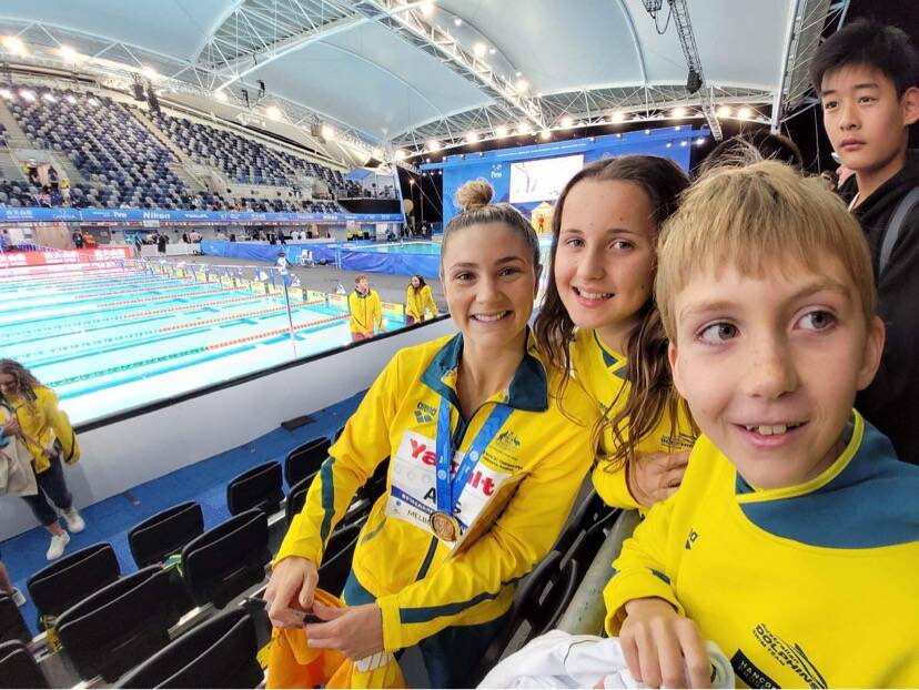 Bendigo East swimmers James and Lauren Davenport with Jenna Strauch after her silver-medal relay swim. Picture contributed