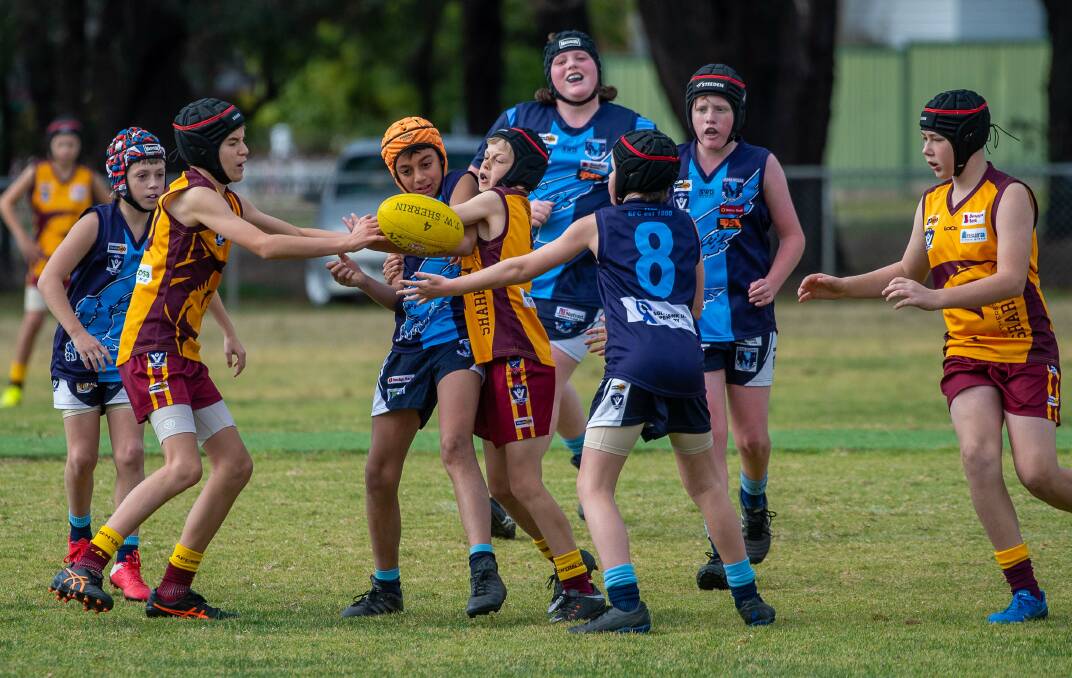 Eaglehawk and St Therese's Maroon players do battle in the under-12A division. Picture: PETER WEAVING