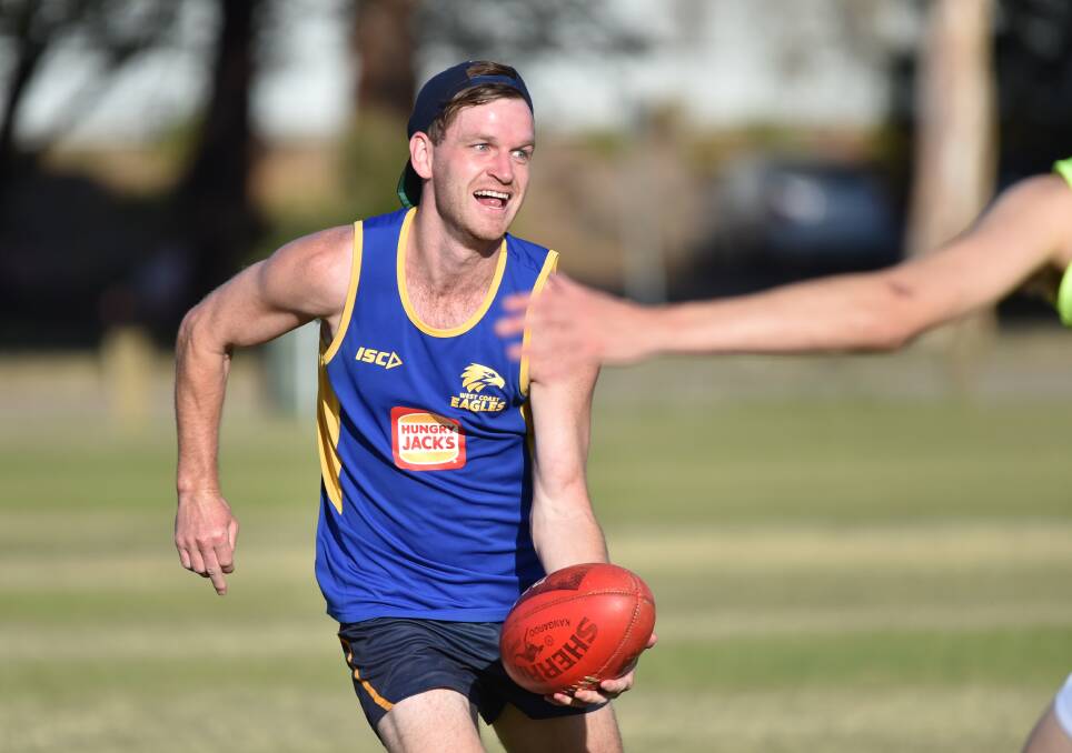 STILL SMILING: Midfielder Nick Stagg proudly wearing his West Coast Eagles singlet.