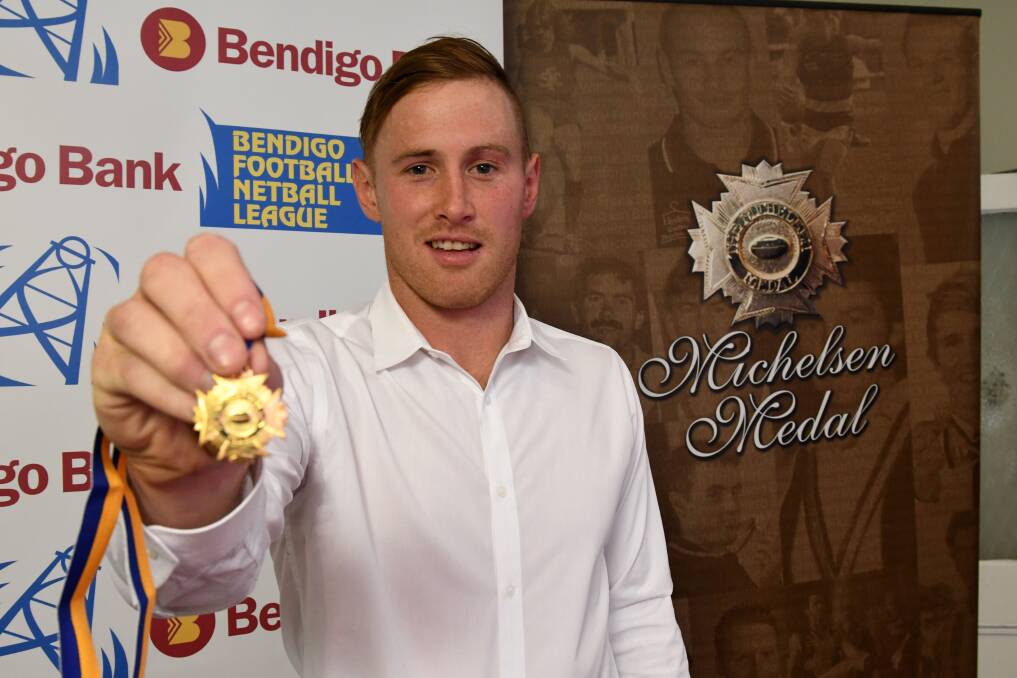 Lachlan Sharp with the Michelsen Medal. Picture: NONI HYETT