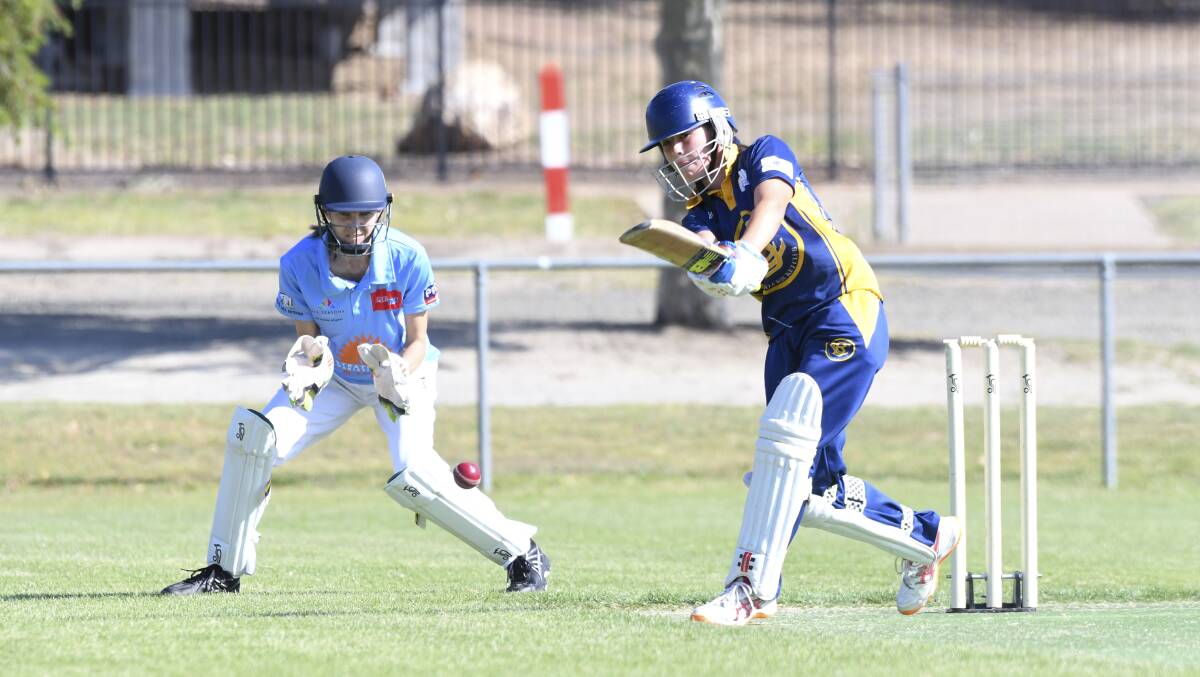 WIDE BALL: Bendigo's Lila Keck attempts to belt a cover drive in front of Strathdale wicket-keeper Laurel Prowse. Picture: NONI HYETT