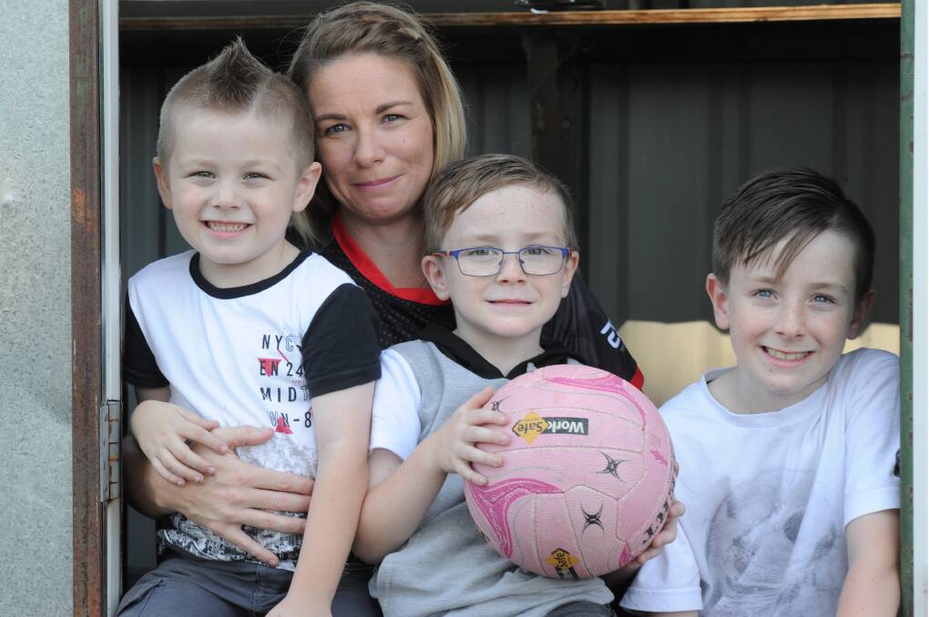 FAMILY AFFAIR: White Hills netballer Lisa Argus with her three sons Mason, Ryder and Lincon.