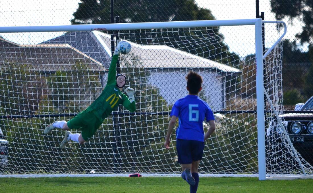 Bendigo City keeper Anthony Hutchinson makes a spectacular save. Picture: CONTRIBUTED