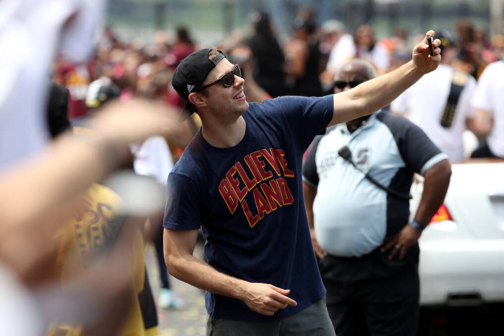 Matthew Dellavedova interacts with Cleveland fans at the Cavs NBA championship parade. Picture: GETTY IMAGES