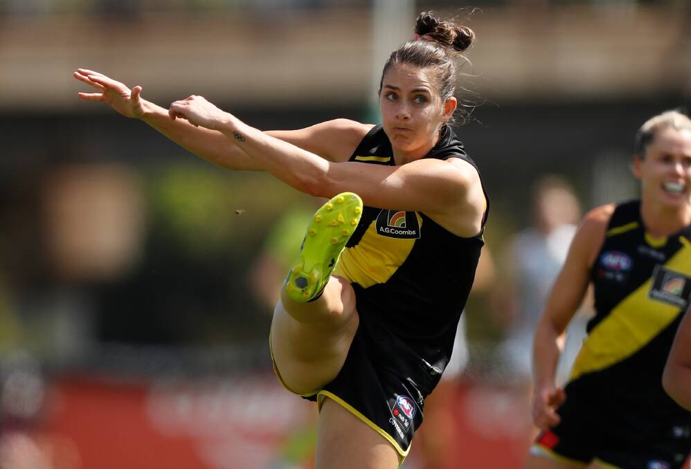 Tessa Lavey pounds the Tigers into attack in her AFLW debut on Sunday. Picture: GETTY IMAGES