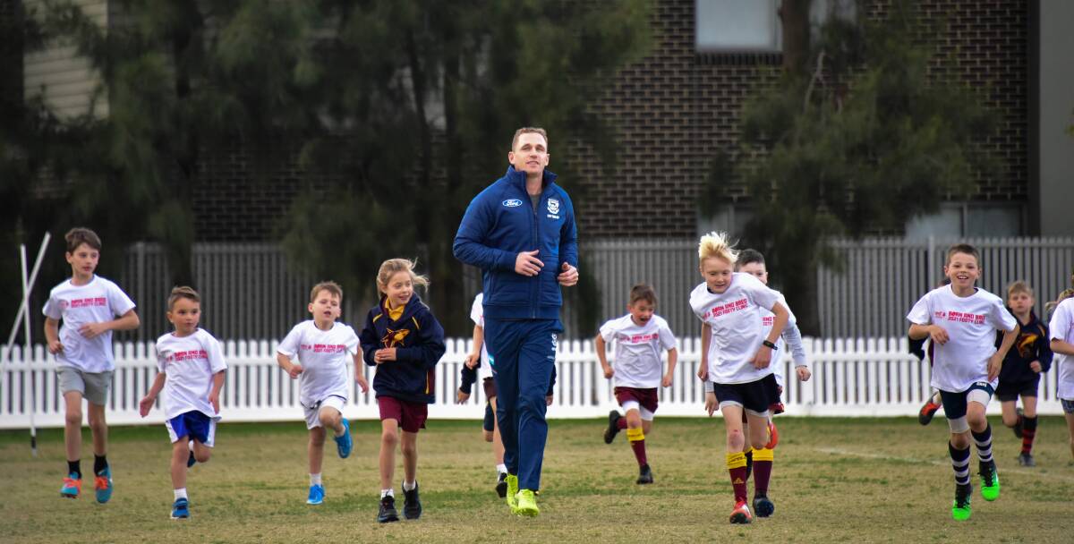 Joel Selwood running a clinic for youngsters from his old school St Therese's Primary School. Picture: NONI HYETT