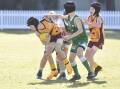 St Therese's and Kangaroo Flat players compete for the ball in the BJFL under-12 division. Pictures: NONI HYETT