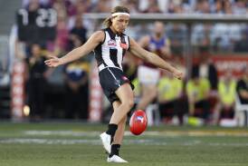 Jack Ginnivan drives Collingwood into attack in the final quarter of Saturday's AFL grand final. Picture by Getty Images
