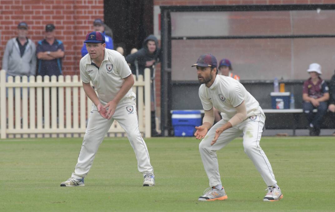 Sandhurst's Taylor Beard and Shane Robinson in last year's grand final win over Strathdale-Maristians.