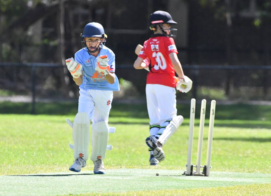PUMPED UP: Strathdale-Maristians' under-12A keeper Flynn Maddren celebrates a run out in the semi-final clash with Bendigo United. Picture: NONI HYETT