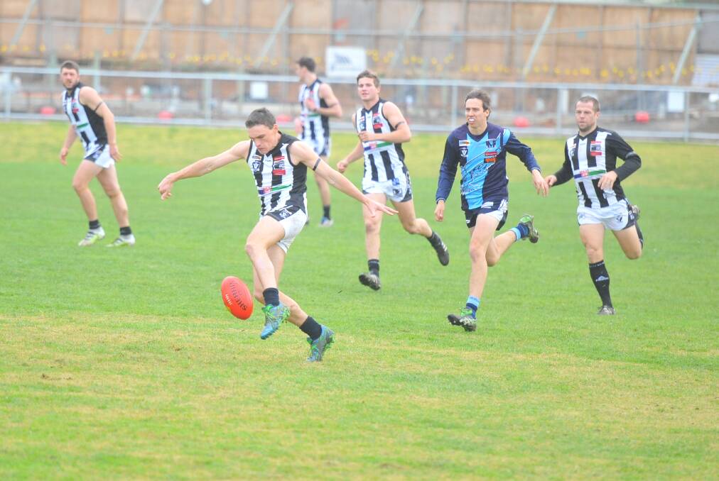 New under-18 coach John Watson in action for the Pies.