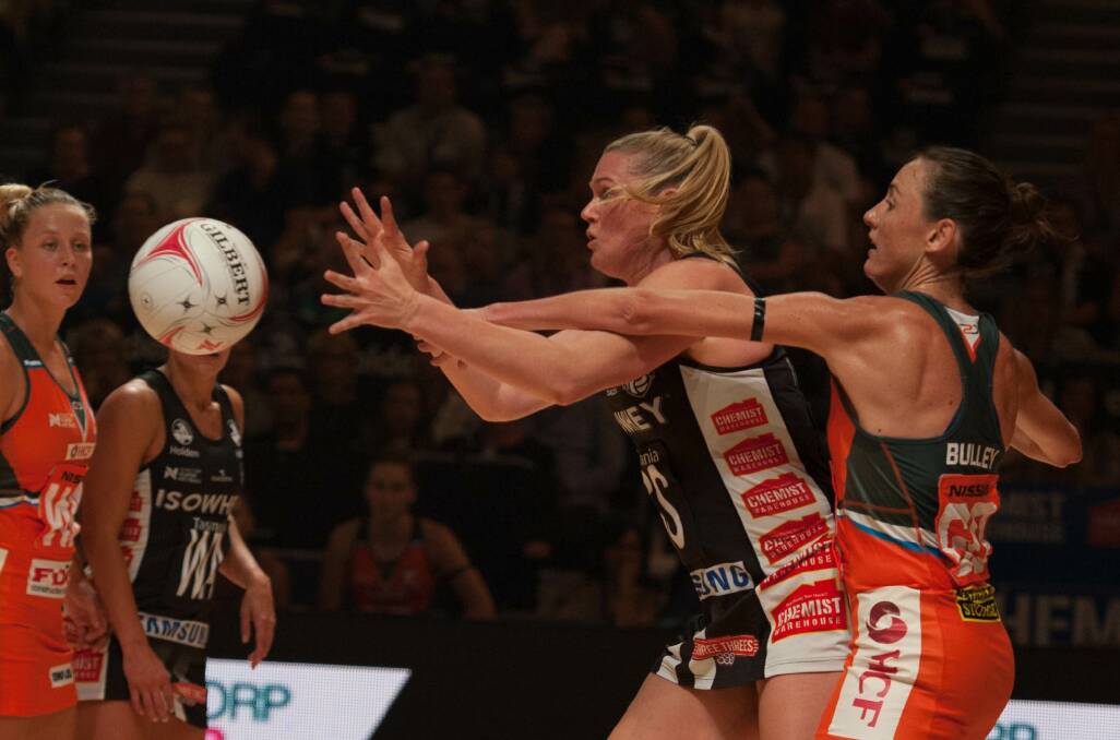 TOP BATTLE: Collingwood's Caitlin Thwaites tries to catch the ball in front of Giants' star Bec Bulley. Picture: PATRICK THWAITES