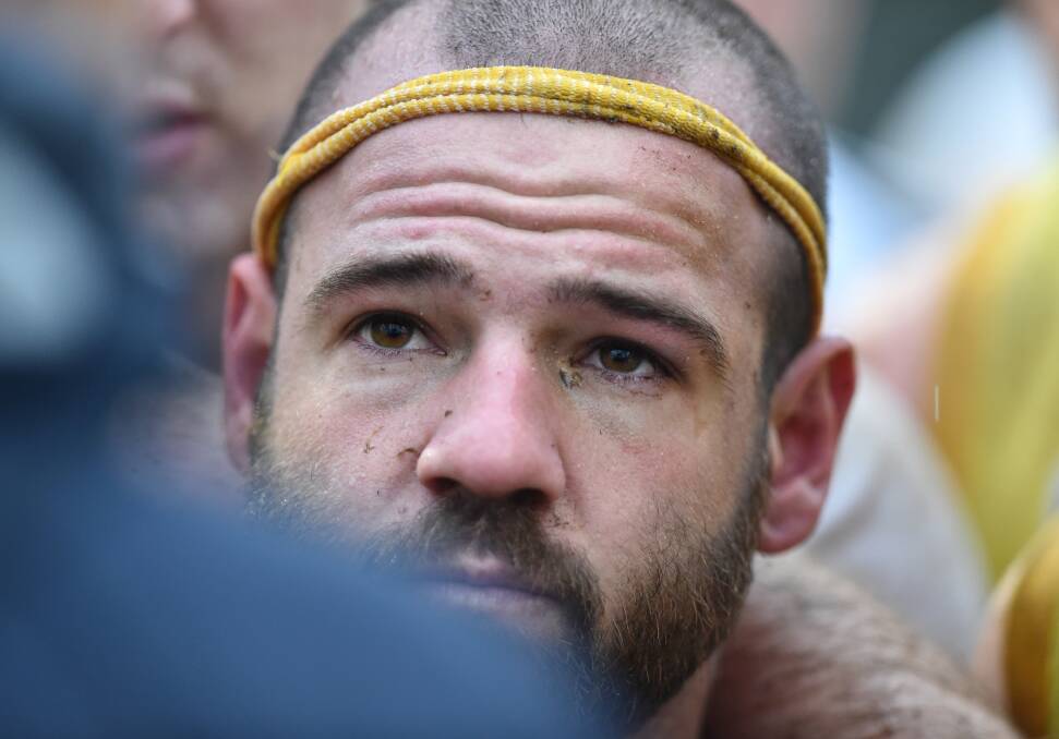 Josh Fromosa and his unique yellow headband made out of a sock. Picture: GLENN DANIELS