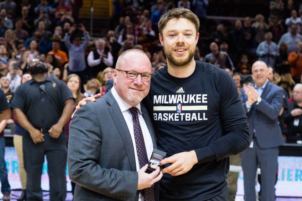 Matthew Dellavedova with Cavs general manager David Griffin. Picture: GETTY IMAGES