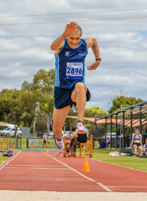 GREAT FORM: Eaglehawk's Terry Hicks soars in the triple jump at an Athletics Bendigo meet. Picture: RYK NEETHLING