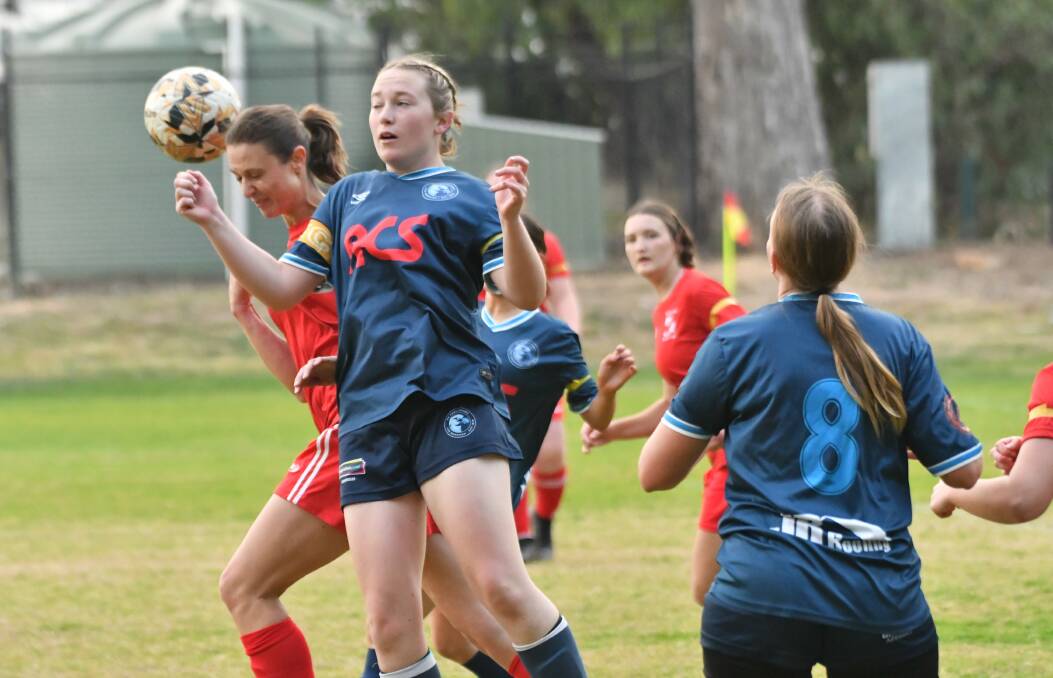 FC Eagehawk's Jess Dover tries to control the ball against Spring Gully. Picture by Adam Bourke