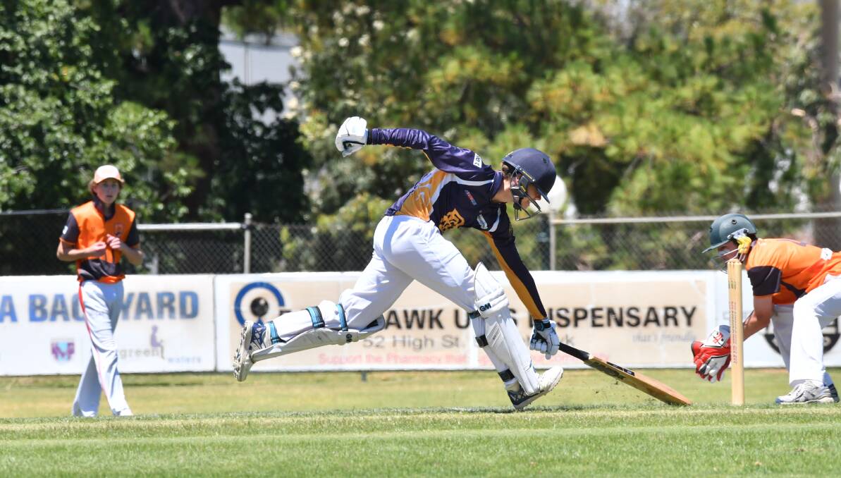 Wil Gilmore slides his bat and makes it home against Goulburn Murray. Picture: NONI HYETT