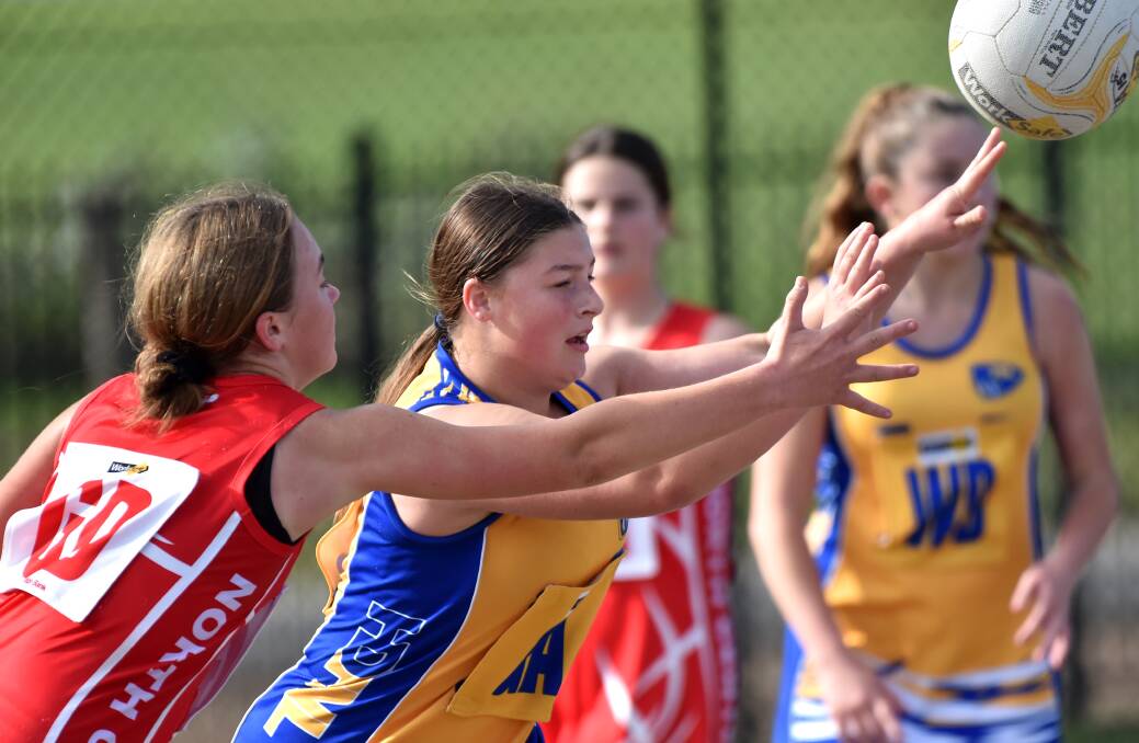 Action from the under-15 netball clash between HDFNL and North Central. Picture: DARREN HOWE
