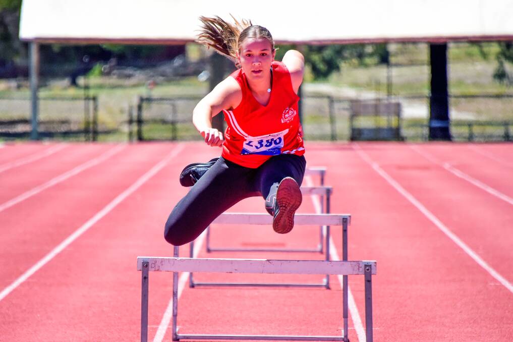 SPEED: Abbey Hromenko works on her hurdling technique ahead of the weekend's championships. Pictures: BRENDAN McCARTHY