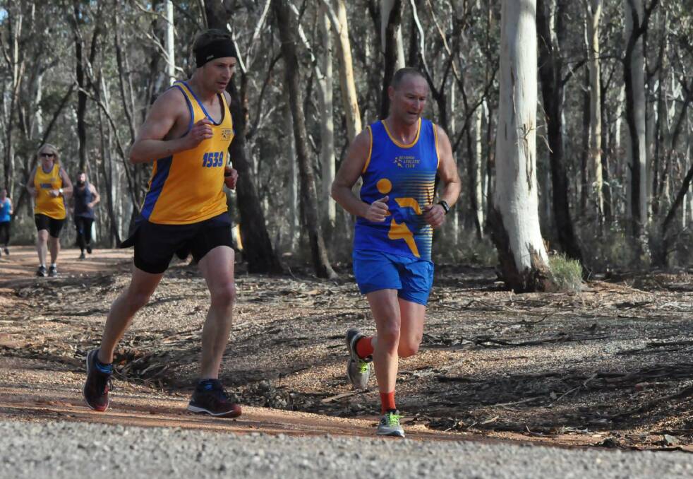 IN FORM: Dale Lowe, right, powers to the front in Sunday's Bendigo Athletics Club event. Picture: CONTRIBUTED