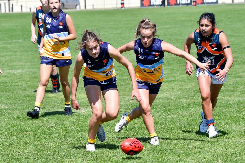 Annabel Strahan leads the race for the ball with team-mate Maeve Tupper. Picture: BRENDAN McCARTHY