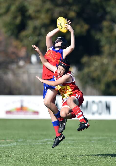 CONTESTED MARK: There was plenty of high-flying action in the under-12 BJFL clash between Marong and South Bendigo at Harry Trott Oval. Picture: GLENN DANIELS