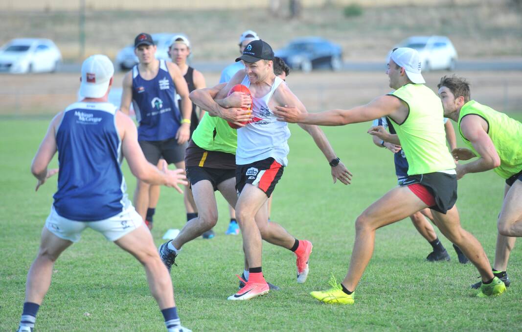 Storm veteran Shannon Geary tries to break a tackle during pre-season training. Picture: ADAM BOURKE