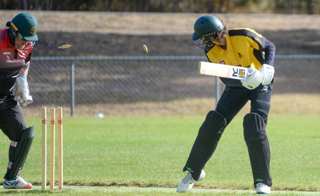 BAILS FLY: Axe Creek's Jesse Trenfield is bowled for 17 against West Bendigo. Picture: DARREN HOWE