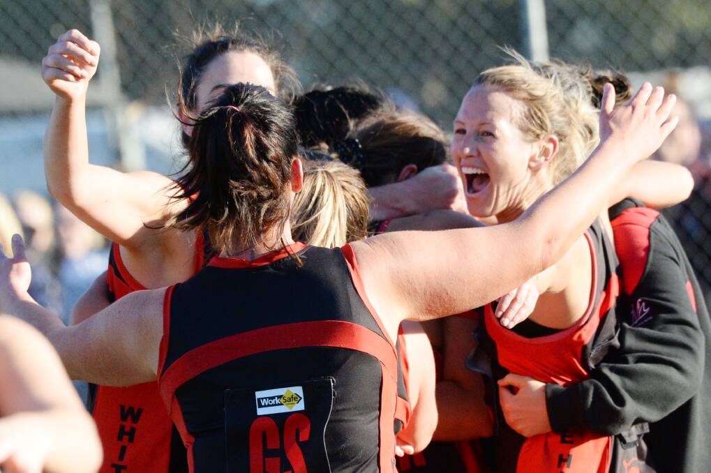 The Demons celebrate their A-grade premiership win last year.