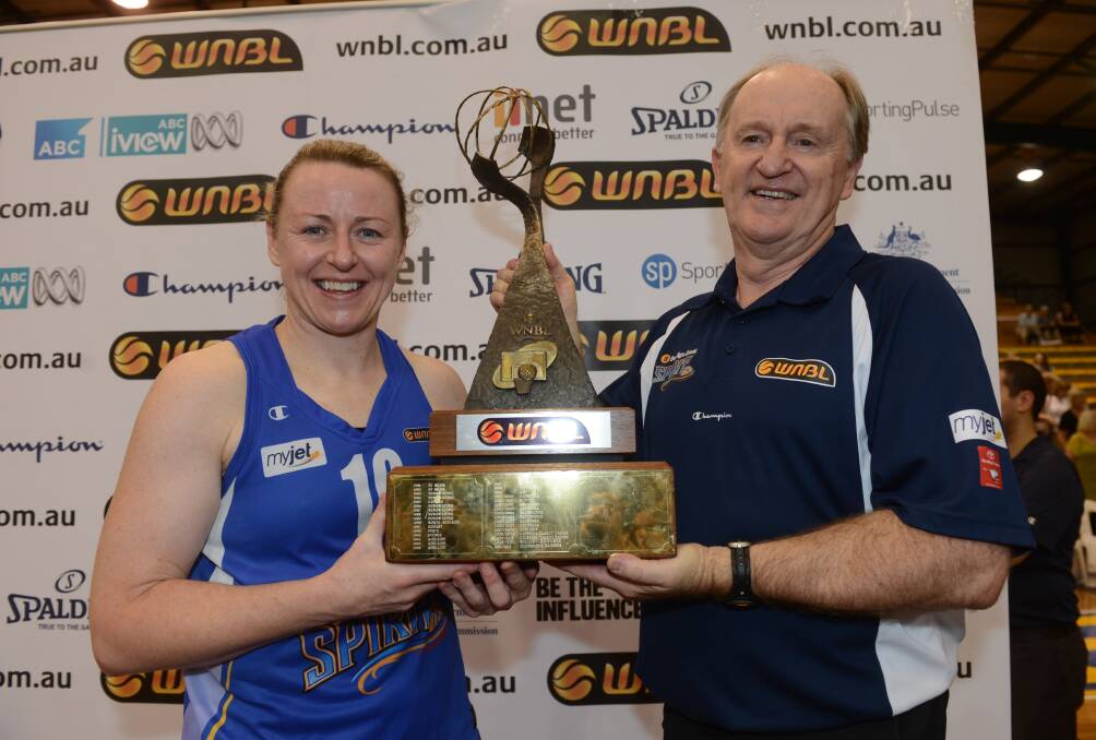 Kristi and Bernie Harrower with the WNBL championship trophy.