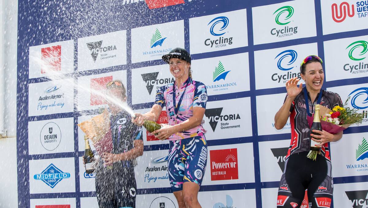 Peta Mullens sprays champagne alongside placegetters Taryn Heather and Rebecca Wiasak. Picture: CHRISTINE ANSORGE

