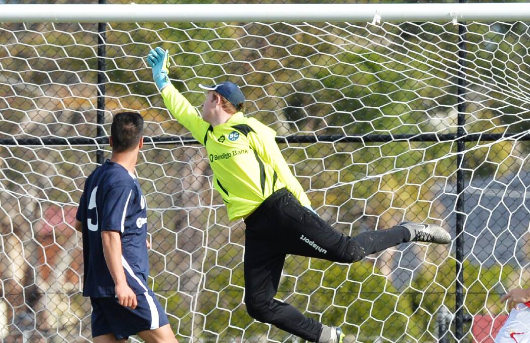 SAVE: The Bendigo City FC senior and under-20 goalkeepers were kept busy on Saturday. Picture: DARREN HOWE