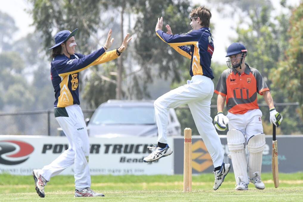 Campbell Smith and Darcy Hunter celebrate a wicket. Picture: NONI HYETT